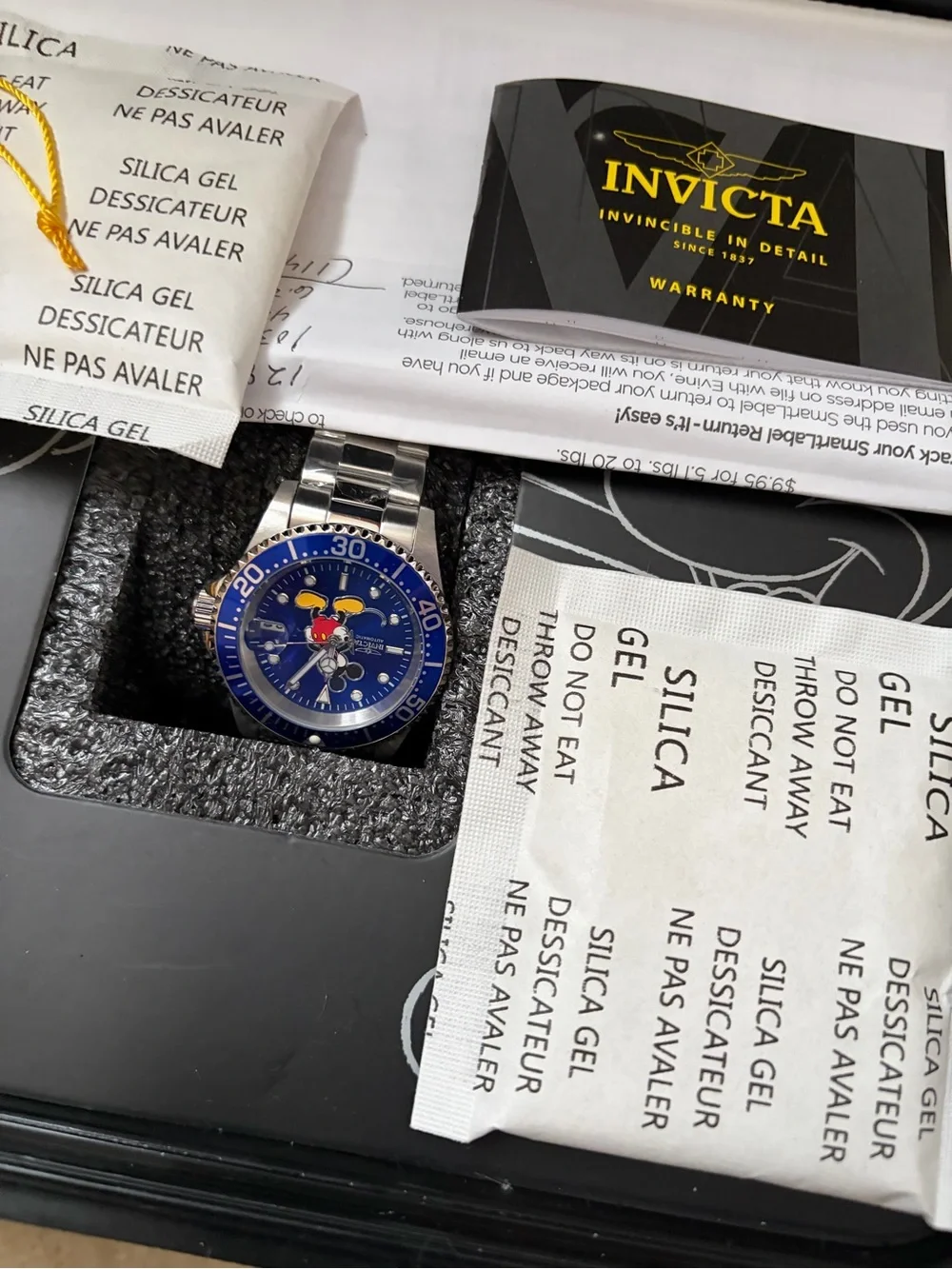 Invicta Men’s Stainless Steel Watch with Blue Dial and Cartoon Accent